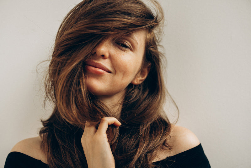 Woman with full, flowing brunette hair